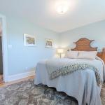Bedroom with queen size bed and ample closets