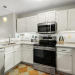 Kitchen with full-size appliances, including induction range, refrigerator, dishwasher, microwave; coffee maker, toaster, and everything you'll need for cooking.