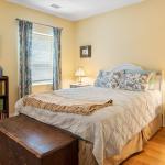 Sunny, welcoming main bedroom, with queen-size bed