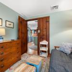 Den has a second television and dresser.