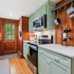 Beautiful new kitchen with egress to rear yard and patio. Electric Induction range and microwave.