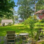 Our side yard leads down to the Beach and has seating to enjoy the view from the grass.