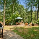 Rear yard has stone patio on hilltop with seating, firepit and BBQ.