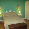 Large Bedroom with Full bed, double closet, cable TV, dresser, desk, bookcase and luxurious bedding